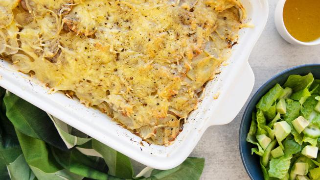 Natural Grocers Layered Potato, Cabbage, & Sausage Gratin Served with a Side Salad